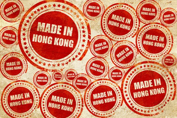 Hecho en Hong Kong, sello rojo en una textura de papel grunge —  Fotos de Stock