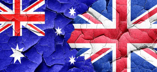 Australia flag with Great Britain flag on a grunge cracked wall — Stock Photo, Image