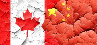 Kanada bayrağı bir grunge Çin bayrağı ile duvar kırık