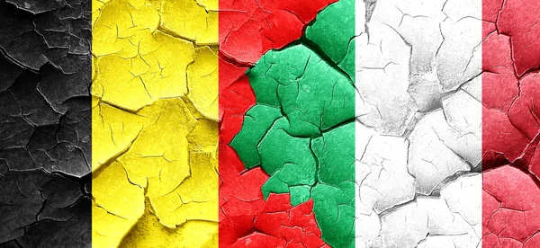 Belgium flag with Italy flag on a grunge cracked wall — Stock Photo, Image