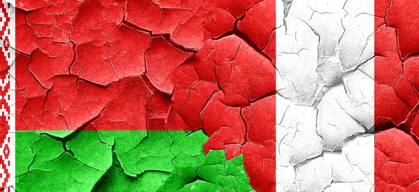 Belarus flag with Peru flag on a grunge cracked wall