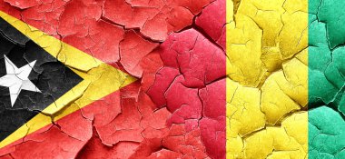 Doğu timor bayrağı bir grunge Gine bayrağı ile duvar kırık