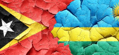 Doğu timor bayrağı bir grunge Ruanda bayrağı ile duvar kırık