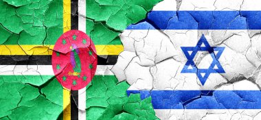 Dominika bayrak bir grunge İsrail bayrağı ile duvar kırık