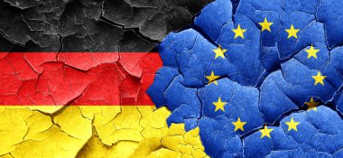 Bir grunge Avrupa Birliği bayrağı ile Alman bayrağı duvar kırık