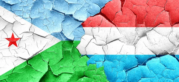 Djibouti flag with Luxembourg flag on a grunge cracked wall