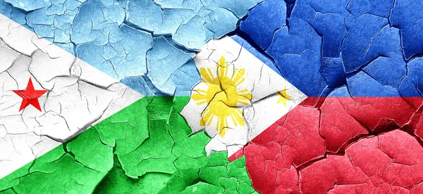 Djibouti flag with Philippines flag on a grunge cracked wall