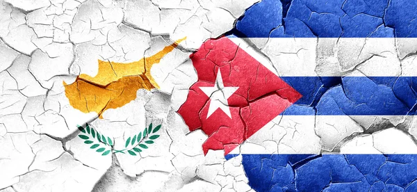 Cyprus flag with cuba flag on a grunge cracked wall — Stock Photo, Image