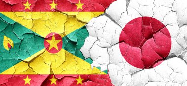 Grenada bayrağı bir grunge Japonya bayrağı ile duvar kırık