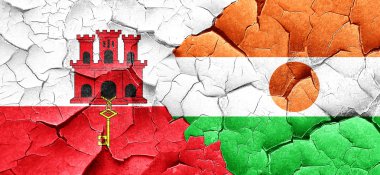 Cebelitarık bayrak bir grunge Nijer bayrağı ile duvar kırık