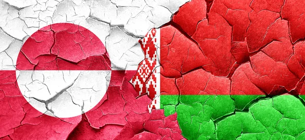 Greenland flag with Belarus flag on a grunge cracked wall — Stock Photo, Image
