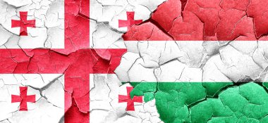 Georgia bayrak bir grunge Macaristan bayrağı ile duvar kırık