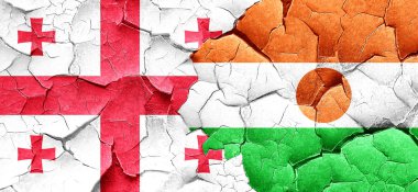 Georgia bayrak bir grunge Nijer bayrağı ile duvar kırık