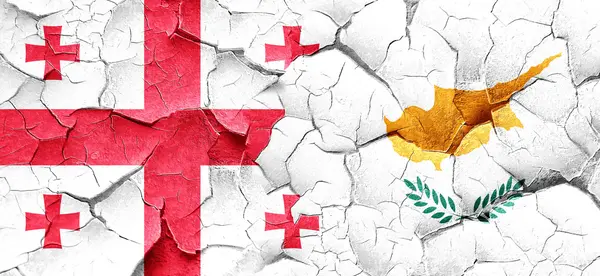 Georgia vlajka vlajka Kypru na grunge popraskané zdi — Stock fotografie