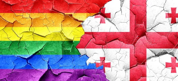 Eşcinsel gurur bayrak bir grunge Georgia bayrağı ile duvar kırık — Stok fotoğraf