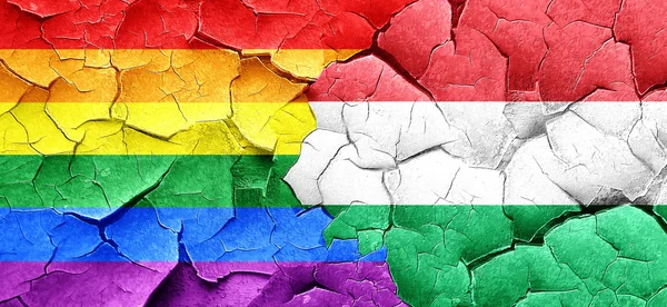 Gay pride flag with Hungary flag on a grunge cracked wall