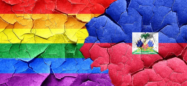 Gay Pride Flagge mit Haitiflagge auf einer Grunge-Risswand — Stockfoto