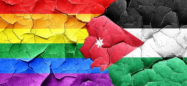 Gay pride flag with Jordan flag on a grunge cracked wall — Stock Photo, Image