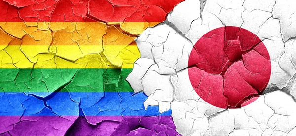 Gay pride flag with Japan flag on a grunge cracked wall — Stock Photo, Image