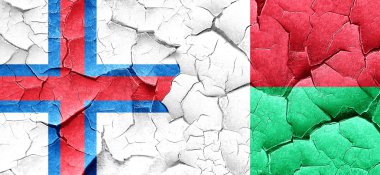 Faroe Adaları bayrağı bir grunge Madagaskar bayrağı ile duvar kırık