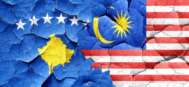 Kosova bayrağı bir grunge Malezya bayrağı ile duvar kırık