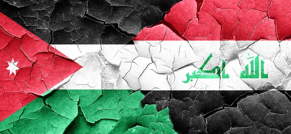Ιορδανία σημαία με τη σημαία του Ιράκ σε ένα grunge ραγισμένα τοίχο — Φωτογραφία Αρχείου