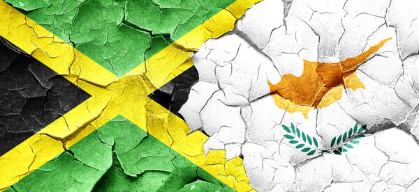 Jamaica flag with Cyprus flag on a grunge cracked wall
