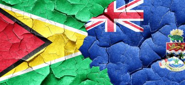 Guyana bayrak bir grunge Cayman Adaları bayrağı ile duvar kırık