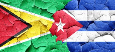 Guyana bayrak bir grunge Küba bayrağı ile duvar kırık