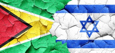 Guyana bayrak bir grunge İsrail bayrağı ile duvar kırık