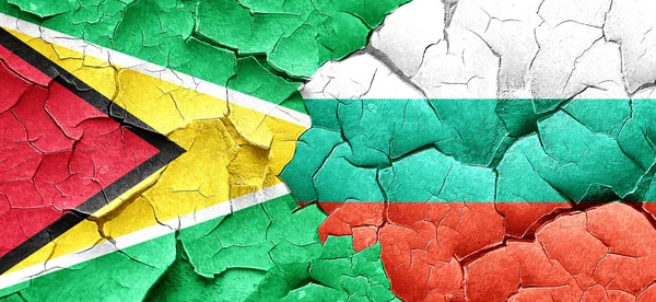 stock image Guyana flag with Bulgaria flag on a grunge cracked wall