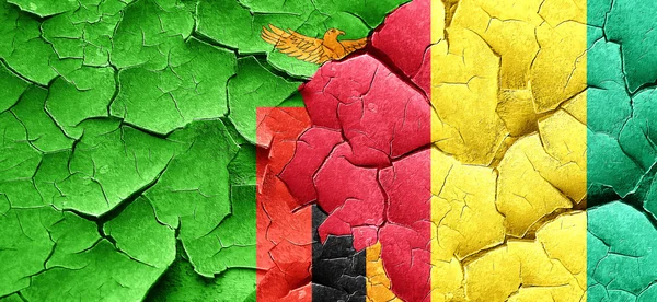 Zambia flag with Guinea flag on a grunge cracked wall — Stock Photo, Image