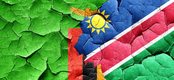 Vlag van Zambia met Namibië vlag op een grunge gebarsten muur — Stockfoto