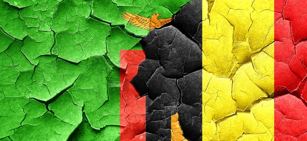 Zambia flag with Belgium flag on a grunge cracked wall — Stock Photo, Image