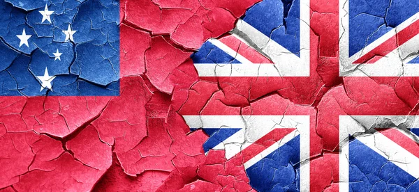 Samoa flag with Great Britain flag on a grunge cracked wall — Stock Photo, Image