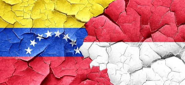 Venezuela lobogója Indonézia zászló egy grunge-a fal repedt — Stock Fotó
