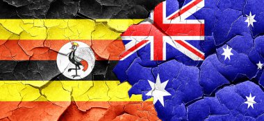 Avustralya bayrağı bir grunge Uganda bayrağıyla duvar kırık