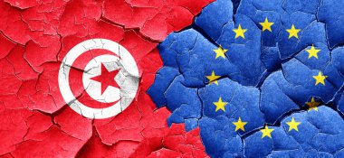 Tunus bayrağı bir grunge Avrupa Birliği bayrağı ile duvar kırık