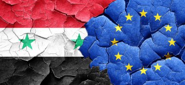 Suriye bayrağı bir grunge Avrupa Birliği bayrağı ile duvar kırık