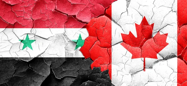 Syrien flagga med Kanada flagga på en grunge knäckt vägg — Stockfoto