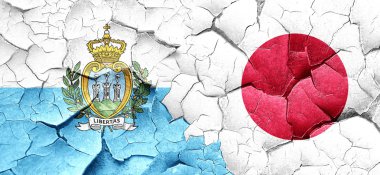 San marino bayrağı bir grunge Japonya bayrağı ile duvar kırık