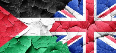 Filistin bayrağı bir grunge Büyük Britanya bayrağı ile duvar kırık