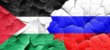 Filistin bayrağı bir grunge Rusya bayrağı ile duvar kırık