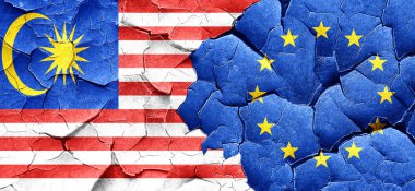 Malezya bayrağı bir grunge Avrupa Birliği bayrağı ile duvar kırık