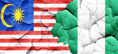 Malezya bayrağı bir grunge Nijerya bayrağı ile duvar kırık