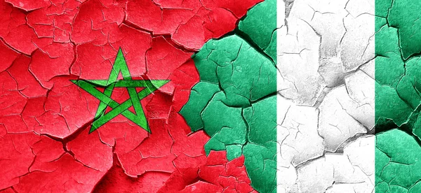 Morocco flag with Nigeria flag on a grunge cracked wall — Stock Photo, Image