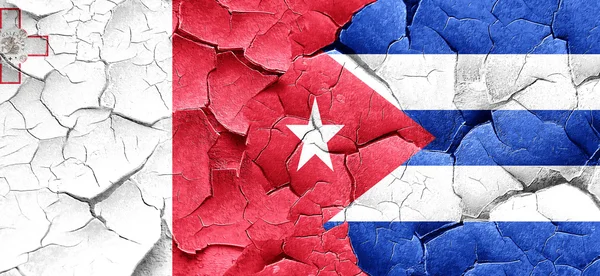 Malta flag with cuba flag on a grunge cracked wall — Stock Photo, Image