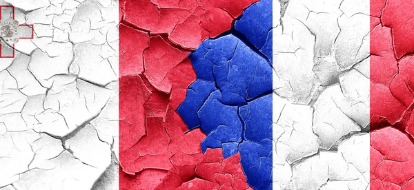 Malta flag with France flag on a grunge cracked wall — Stock Photo, Image