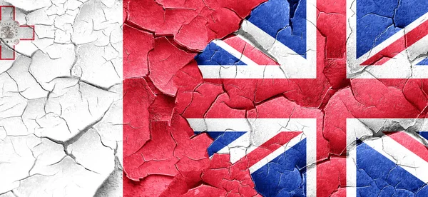Malta flag with Great Britain flag on a grunge cracked wall — Stock Photo, Image