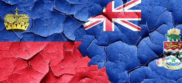 Liechtenstein flag with Cayman islands flag on a grunge cracked — Stock Photo, Image